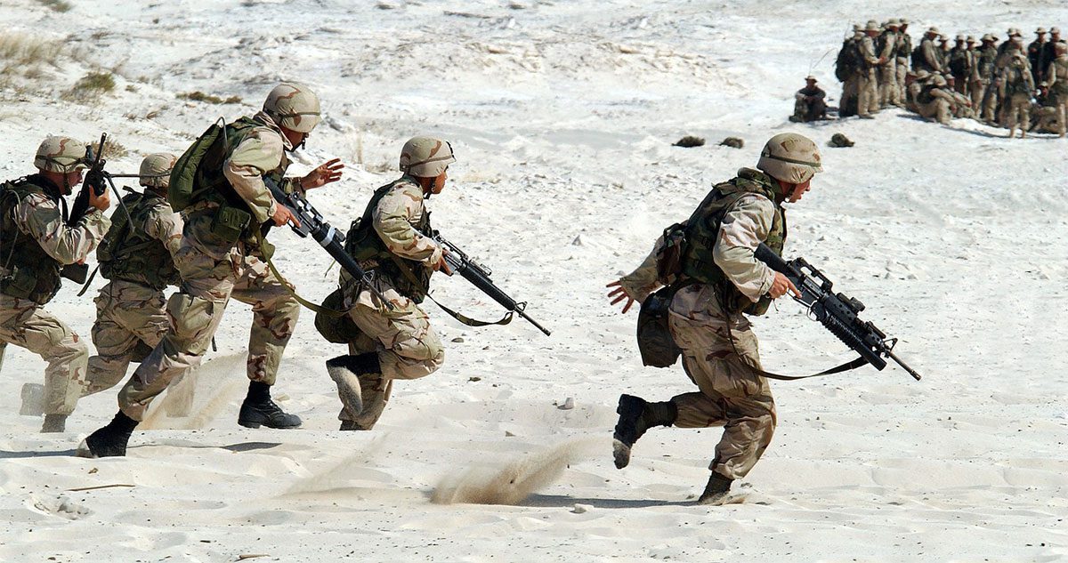 soldiers running across the desert